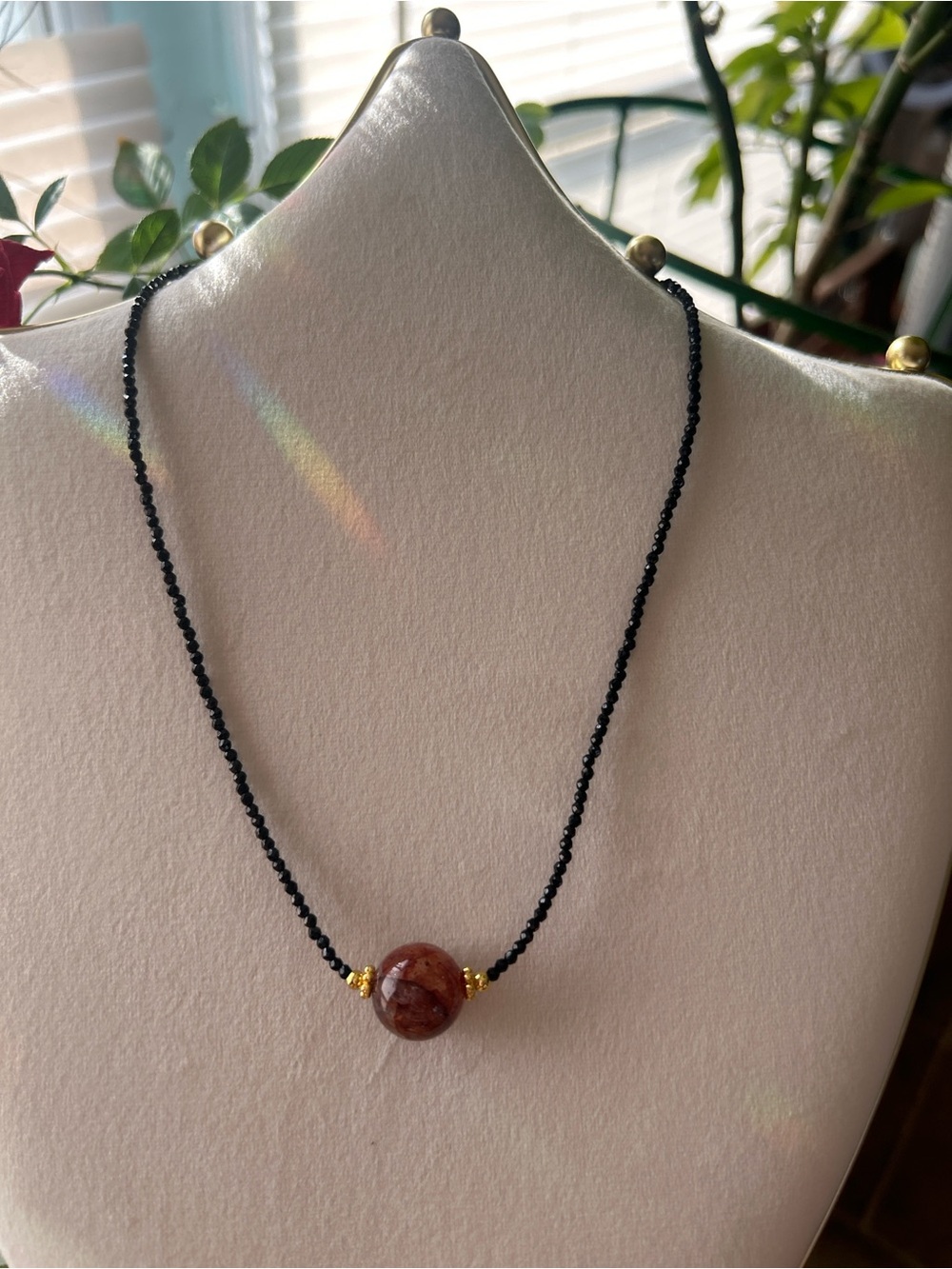 Black Spinel Beaded Necklace with Gold Accents and Fire Quartz Crystal